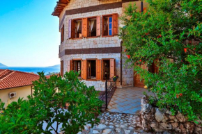 Отель Kaş, merkezde, deniz manzaralı, 4 kişilik aile evleri  Каш